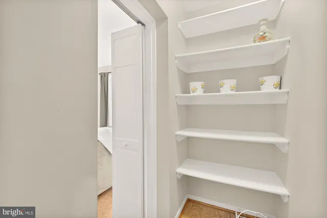 a shelf with cup and plates