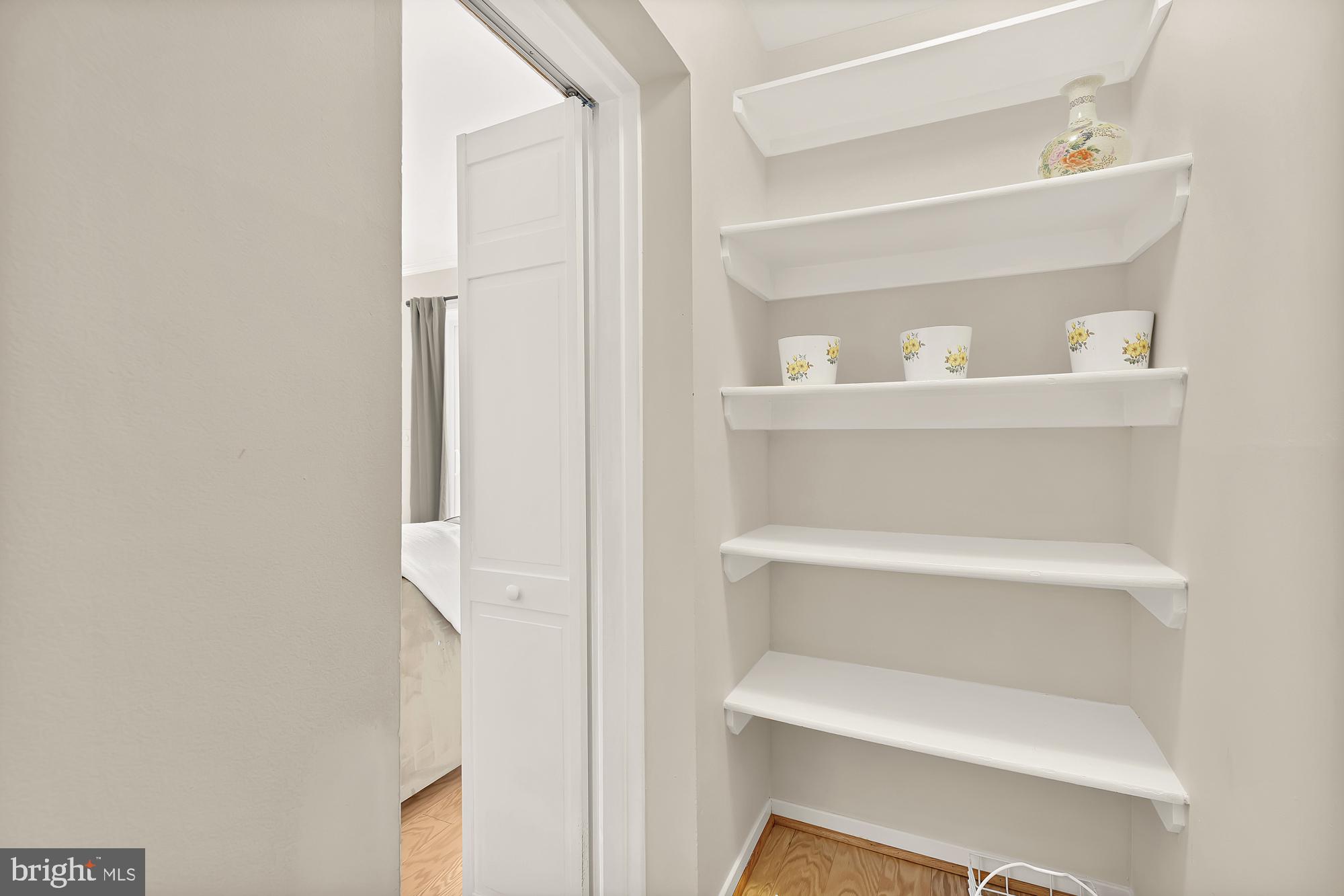 1801 Park Road Northwest, Unit 2 Washington, DC 20010 - Photo 18 of 45 a shelf with cup and plates