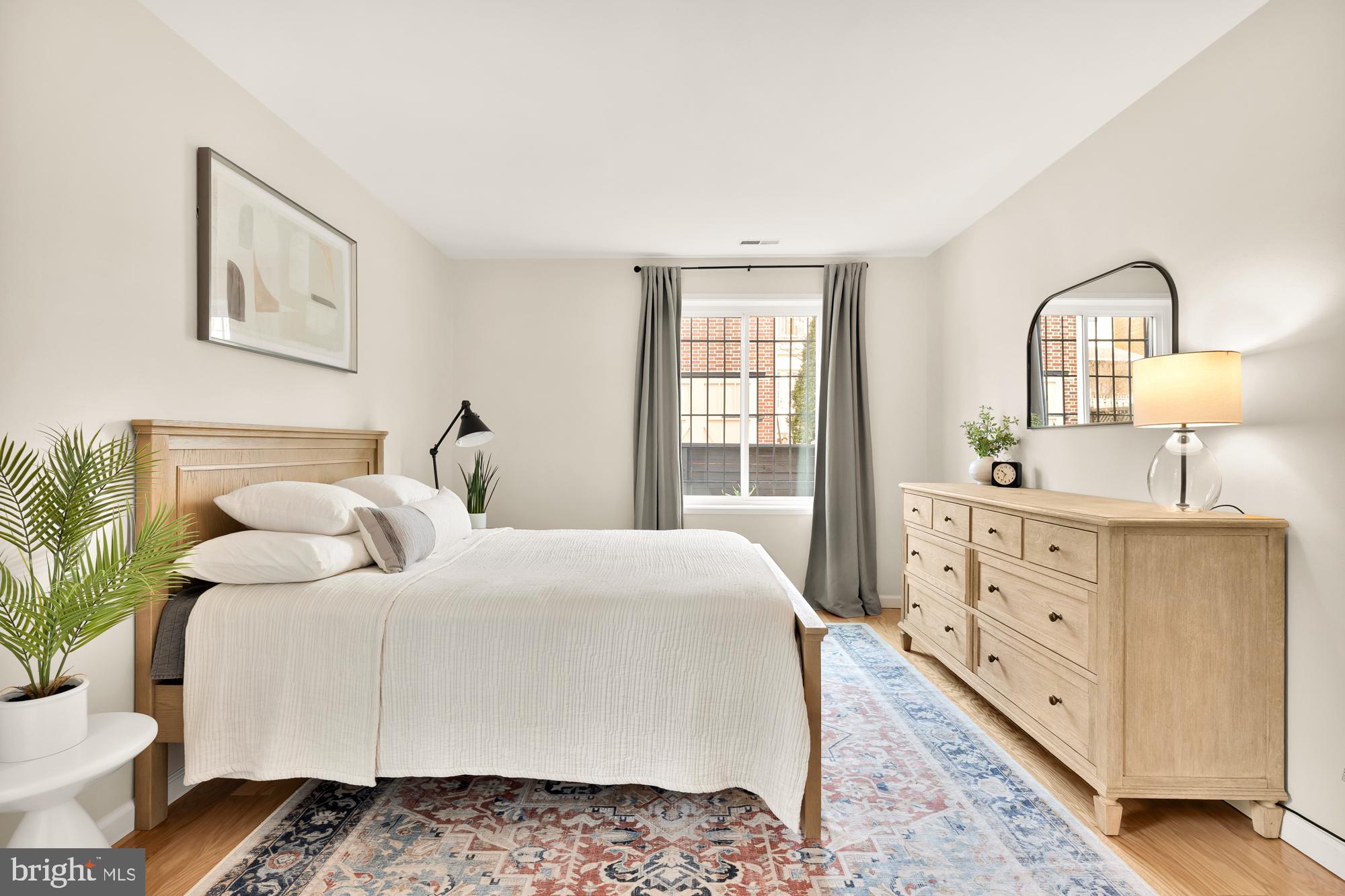 1801 Park Road Northwest, Unit 2 Washington, DC 20010 - Photo 24 of 45 a bedroom with a bed and a dresser