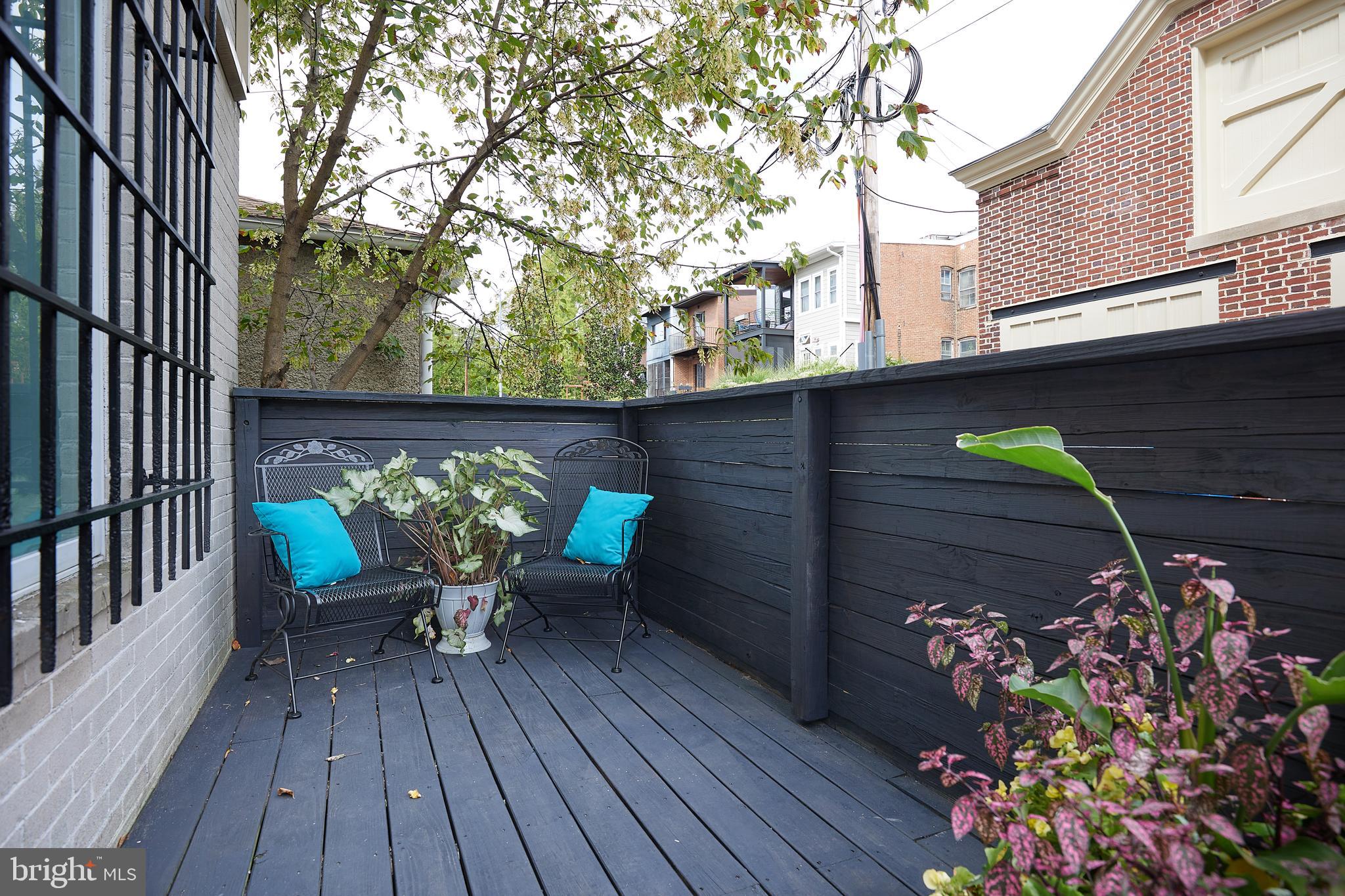 1801 Park Road Northwest, Unit 2 Washington, DC 20010 - Photo 30 of 45 a view of a chairs in patio of the house