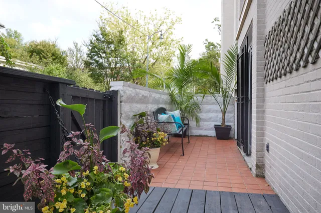 a view of a backyard with sitting area