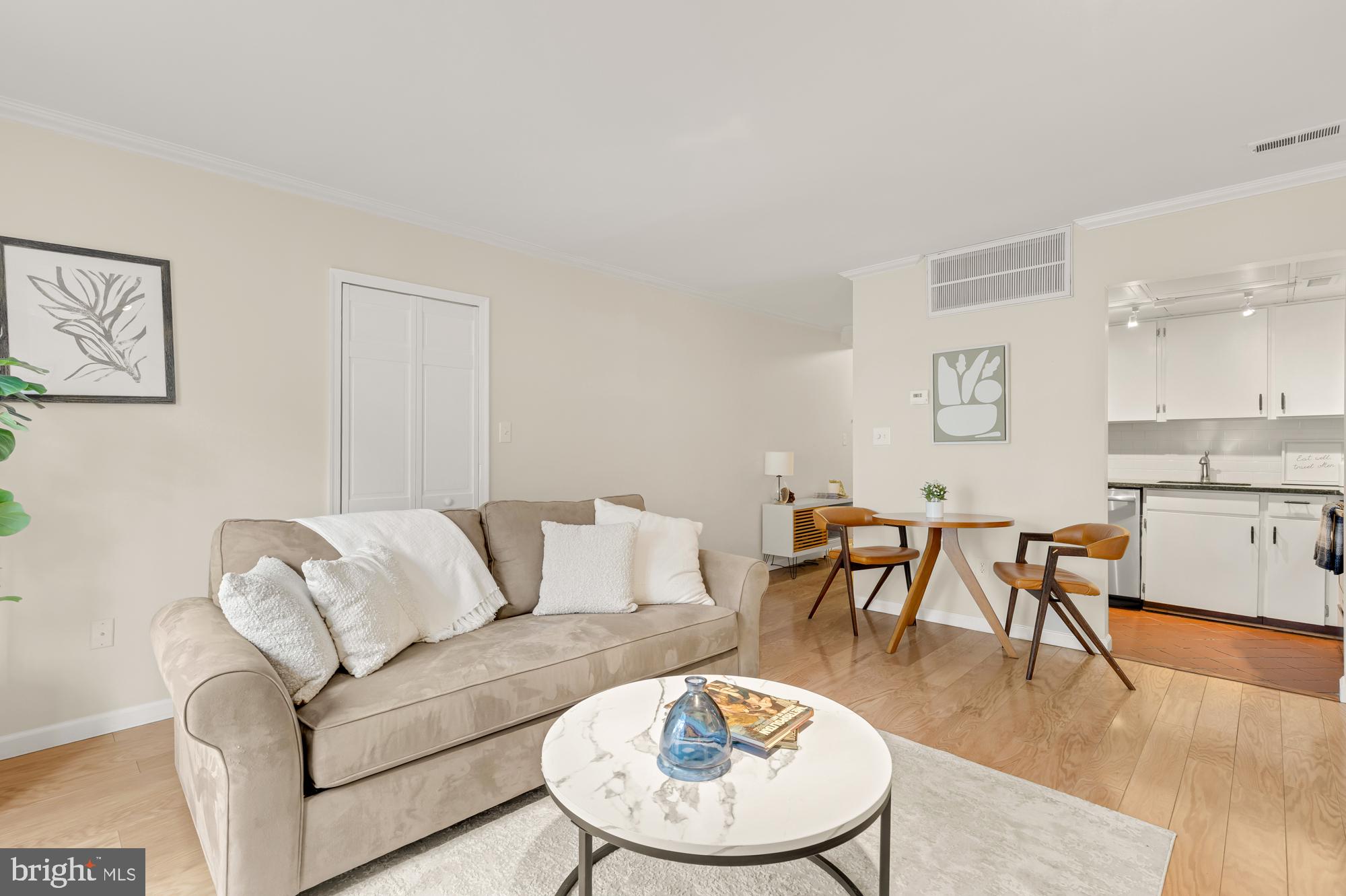 1801 Park Road Northwest, Unit 2 Washington, DC 20010 - Photo 8 of 45 a living room with furniture kitchen view and a dining table