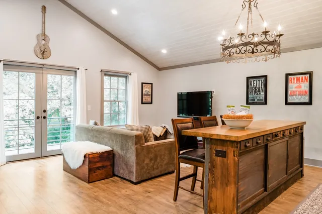 a view of a livingroom with furniture window and wooden floor