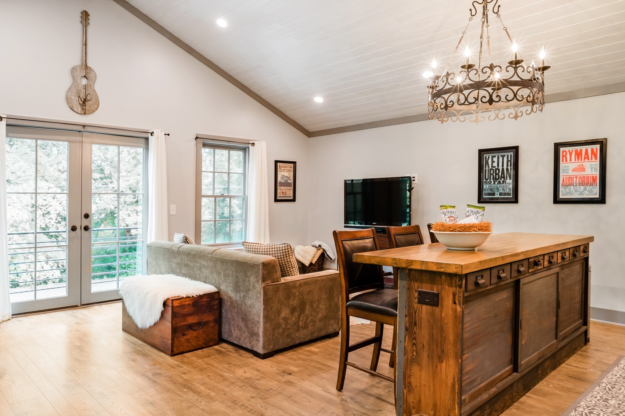 a view of a livingroom with furniture window and wooden floor