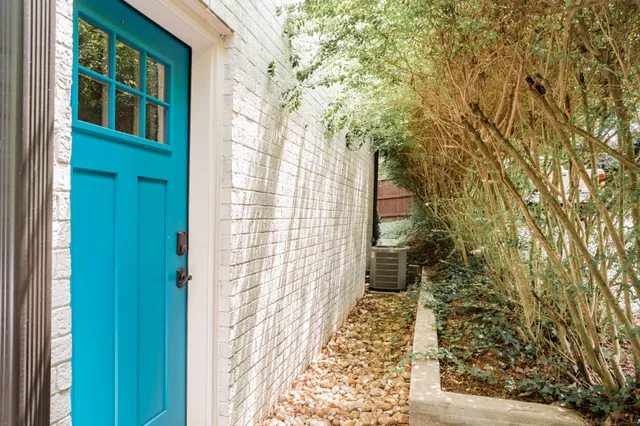 a balcony view with a garden