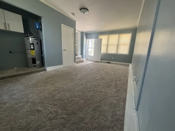 a view of an empty room with a window