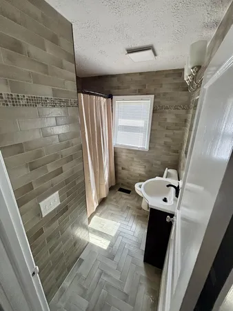 a bathroom with a sink and a shower