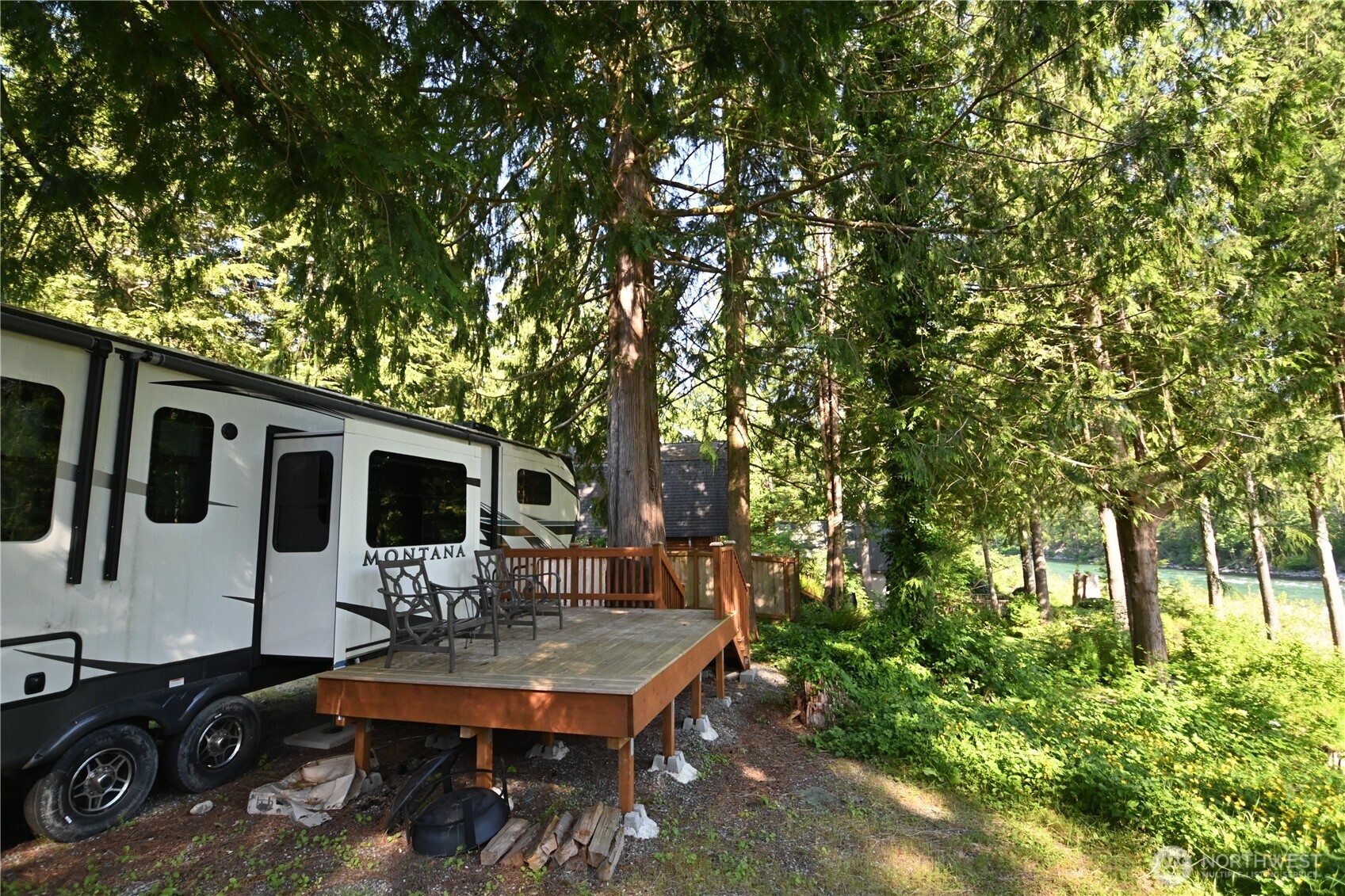44725 Fir Road Gold Bar, WA 98251 - Photo 10 of 17 a backyard of a house with yard table and chairs