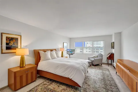 a bed room with bed and a couch
