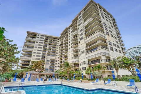 a view of swimming pool with outdoor seating