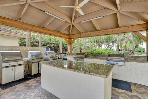 a view of a chairs in patio and a yard