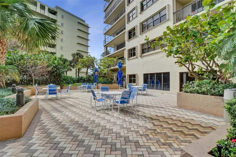 a view of a swimming pool with a yard