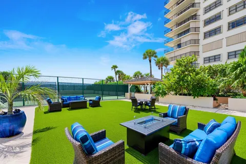 a view of swimming pool with seating area and furniture