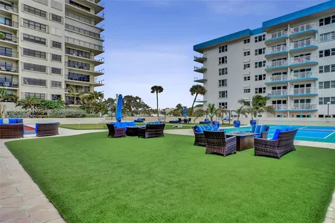 a view of swimming pool with outdoor seating