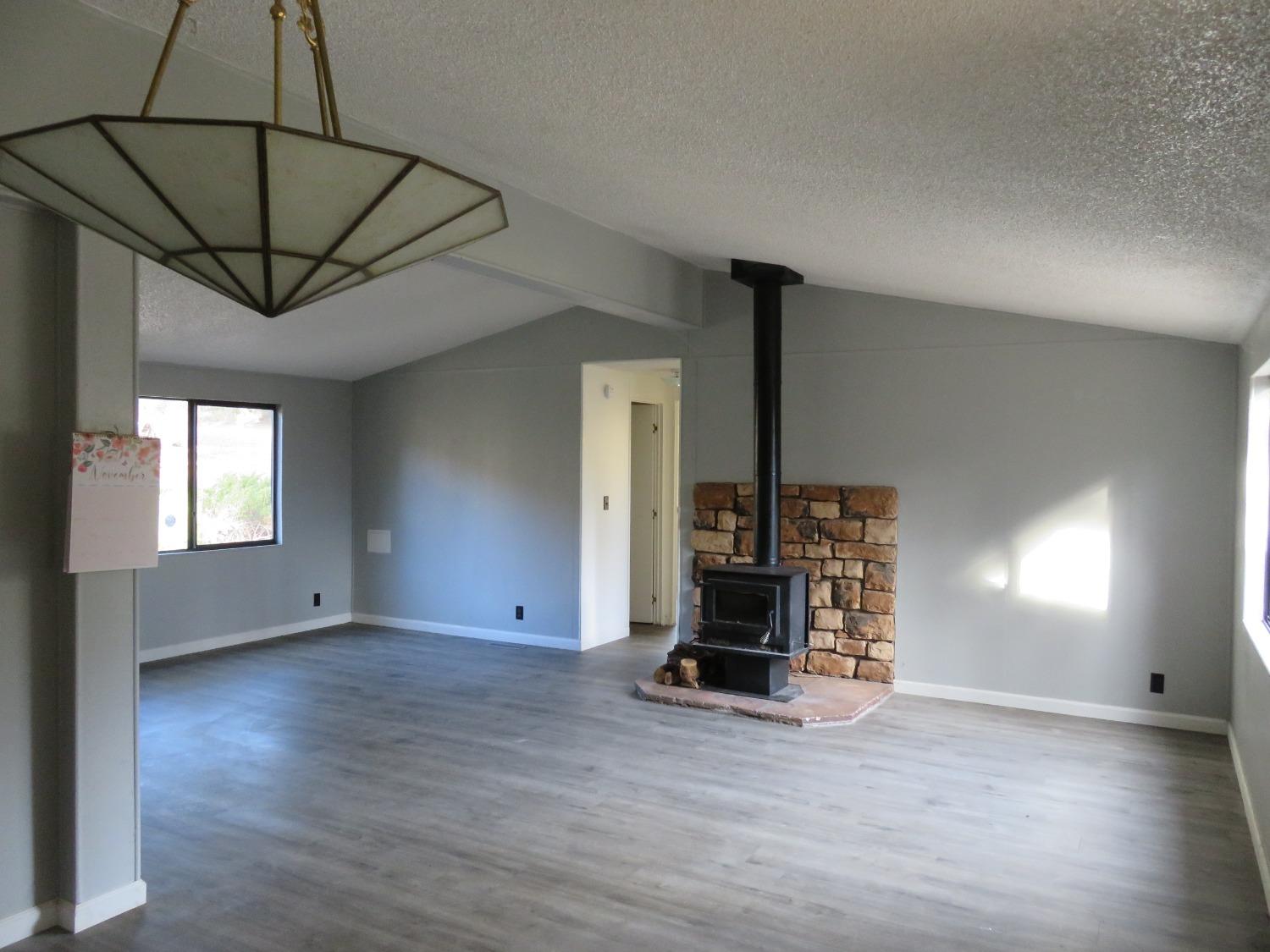 4426 Bald Mountain Road West Point, CA 95255 - Photo 20 of 45 a view of empty room with wooden floor and fan