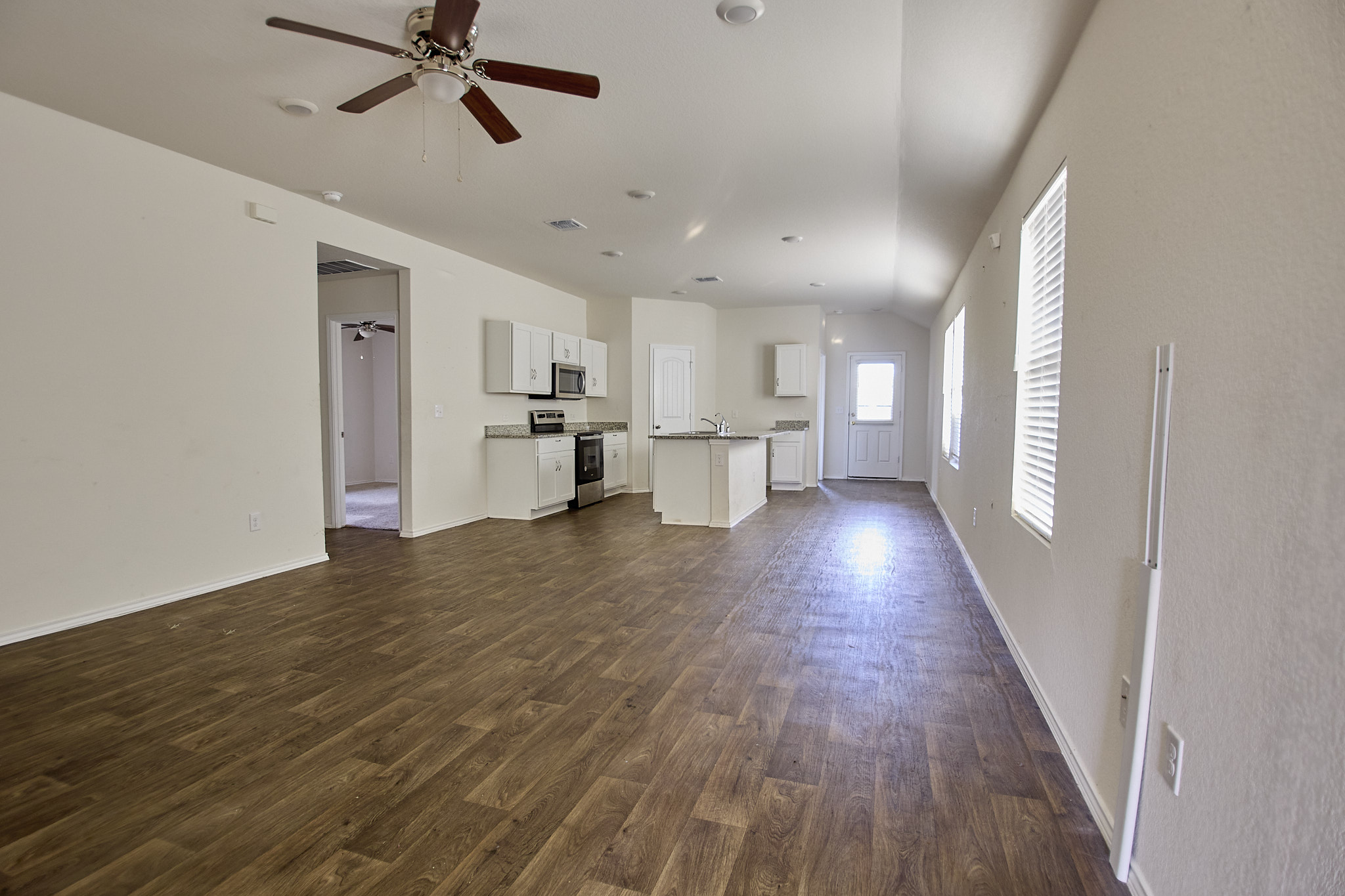 12008 Roving Pass Elgin, TX 78621 - Photo 4 of 20 Spacious and Open Living/ DIning/ Kitchen leaves Lots of options for you to imagine!