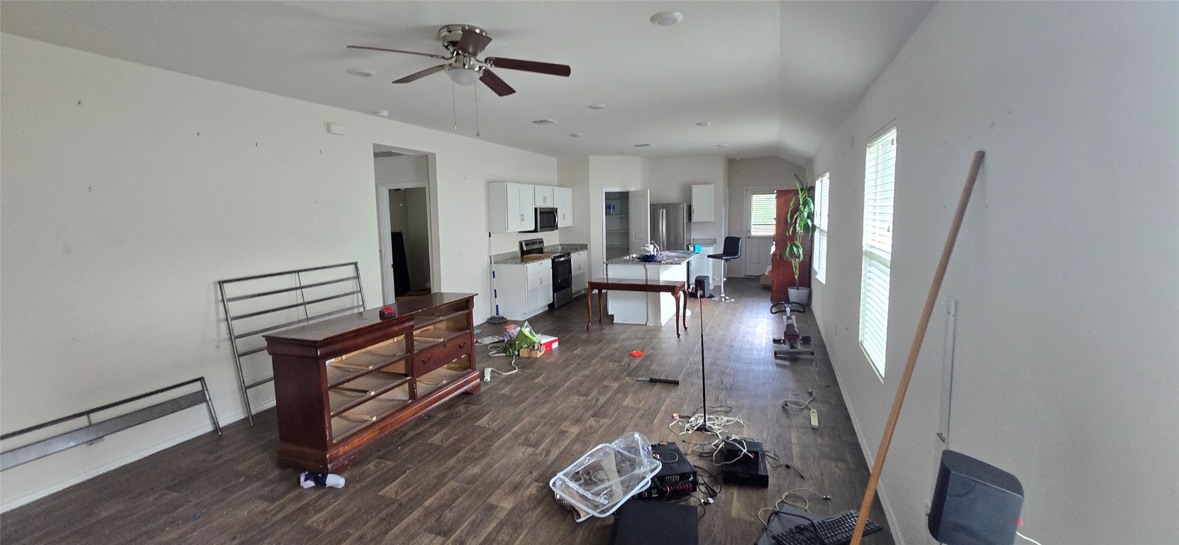 12008 Roving Pass Elgin, TX 78621 - Photo 7 of 9 a living room with furniture and a wooden floor