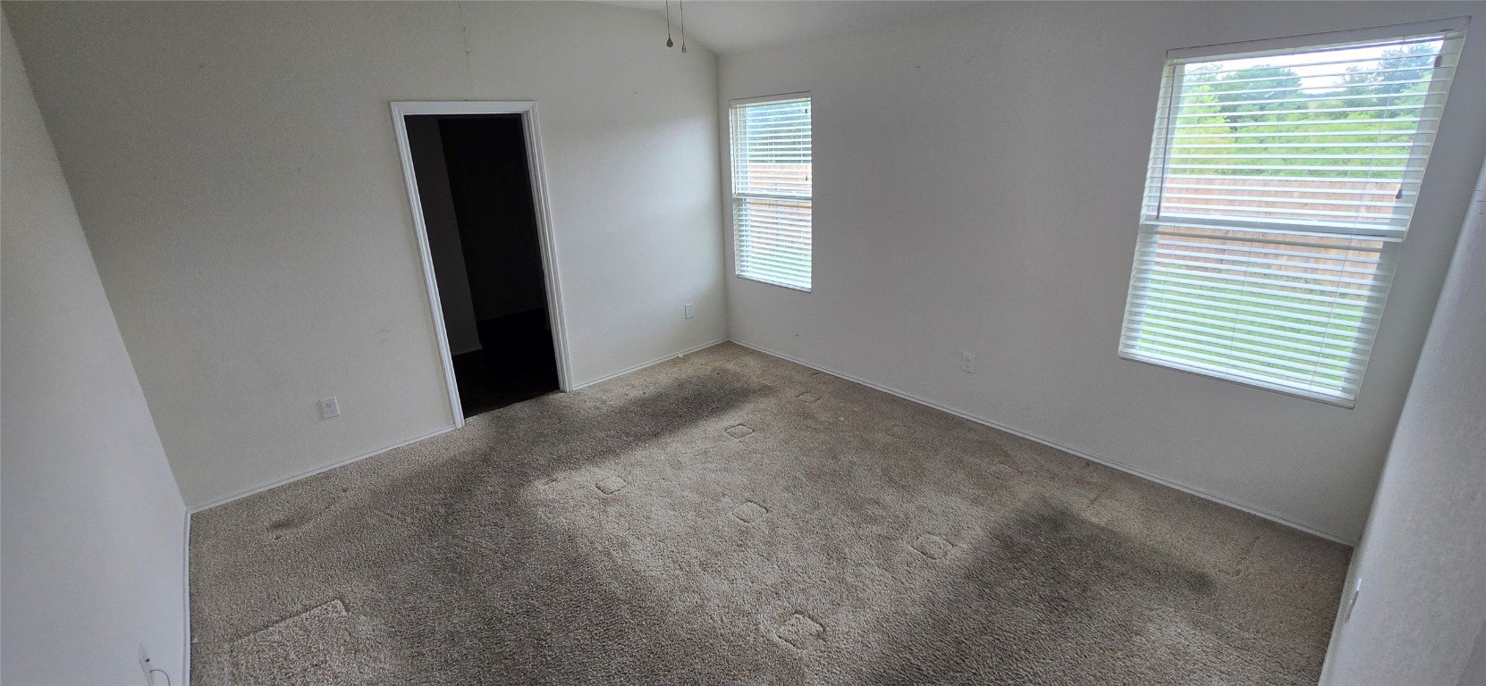 12008 Roving Pass Elgin, TX 78621 - Photo 8 of 9 an empty room with windows