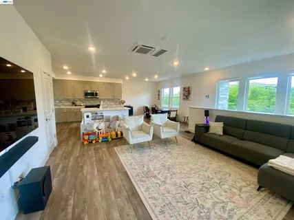 a living room with lots of furniture and a flat screen tv
