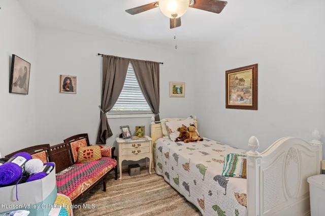 a bedroom with furniture and a wooden floor