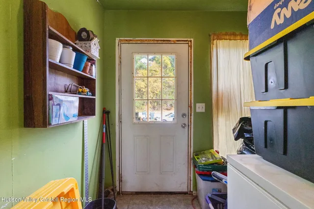 a view of an entryway with wooden floor