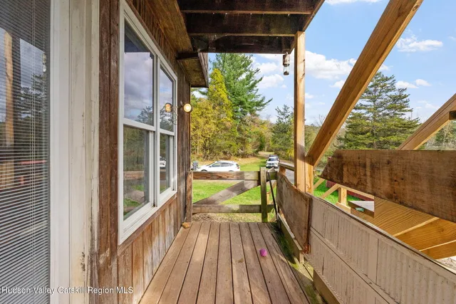 a view of balcony with wooden floor