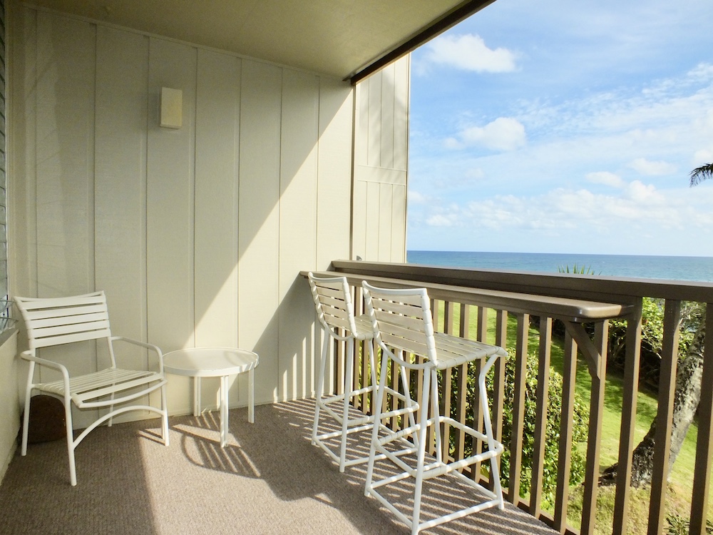 320 Papaloa Road, Unit 102 Kapaa, HI 96746 - Photo 12 of 22 a view of an chairs and table in the balcony