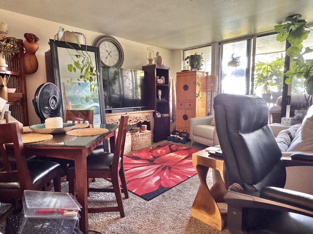 320 Papaloa Road, Unit 102 Kapaa, HI 96746 - Photo 9 of 22 a view of a dining room with furniture window and wooden floor