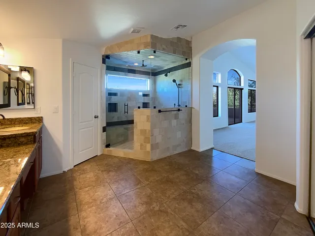 a view of a living room with a fireplace and cabinets