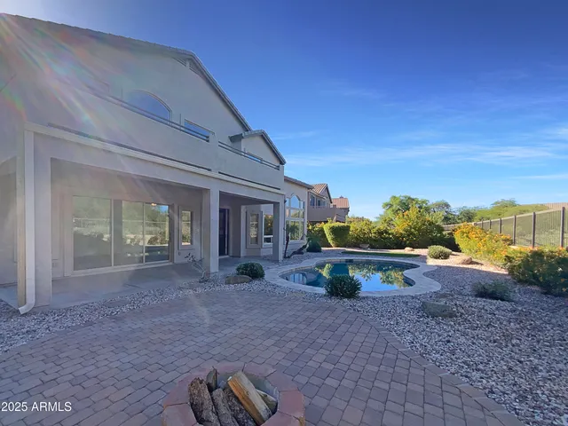 a view of a house with backyard porch and outdoor space