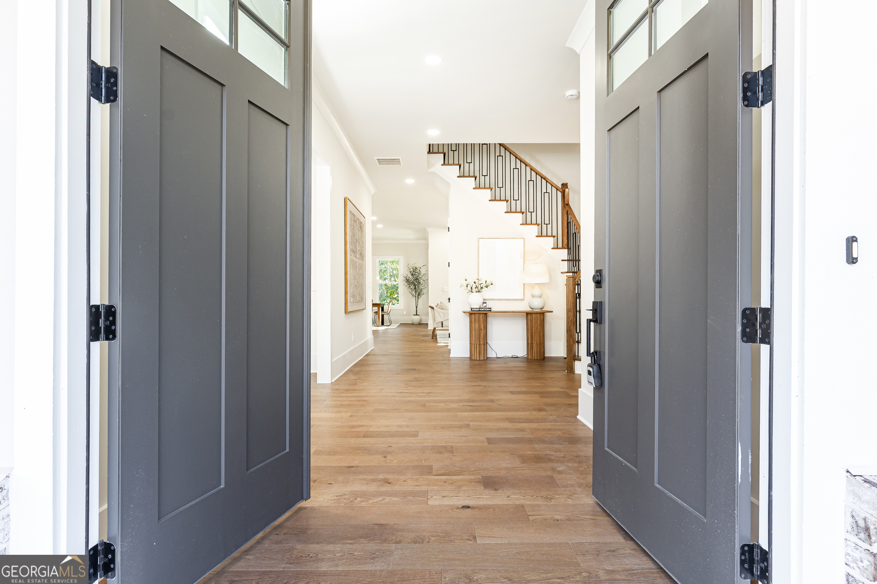 1992 Highgrove Court Atlanta, GA 30349 - Photo 11 of 22 a view of a hallway with wooden floor windows and a kitchen view