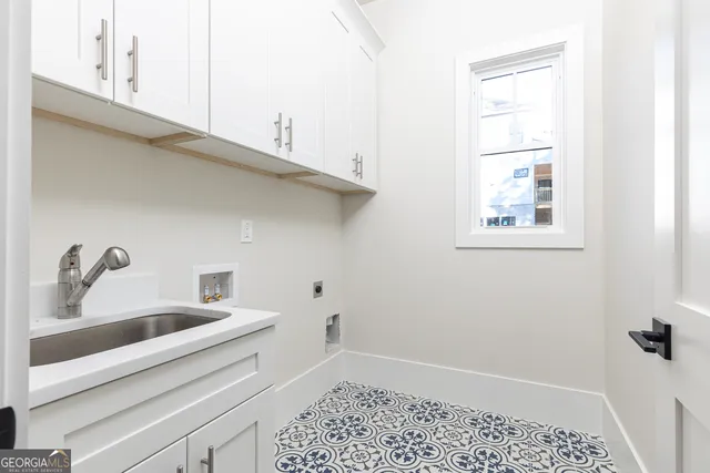 a bathroom with a sink and a window