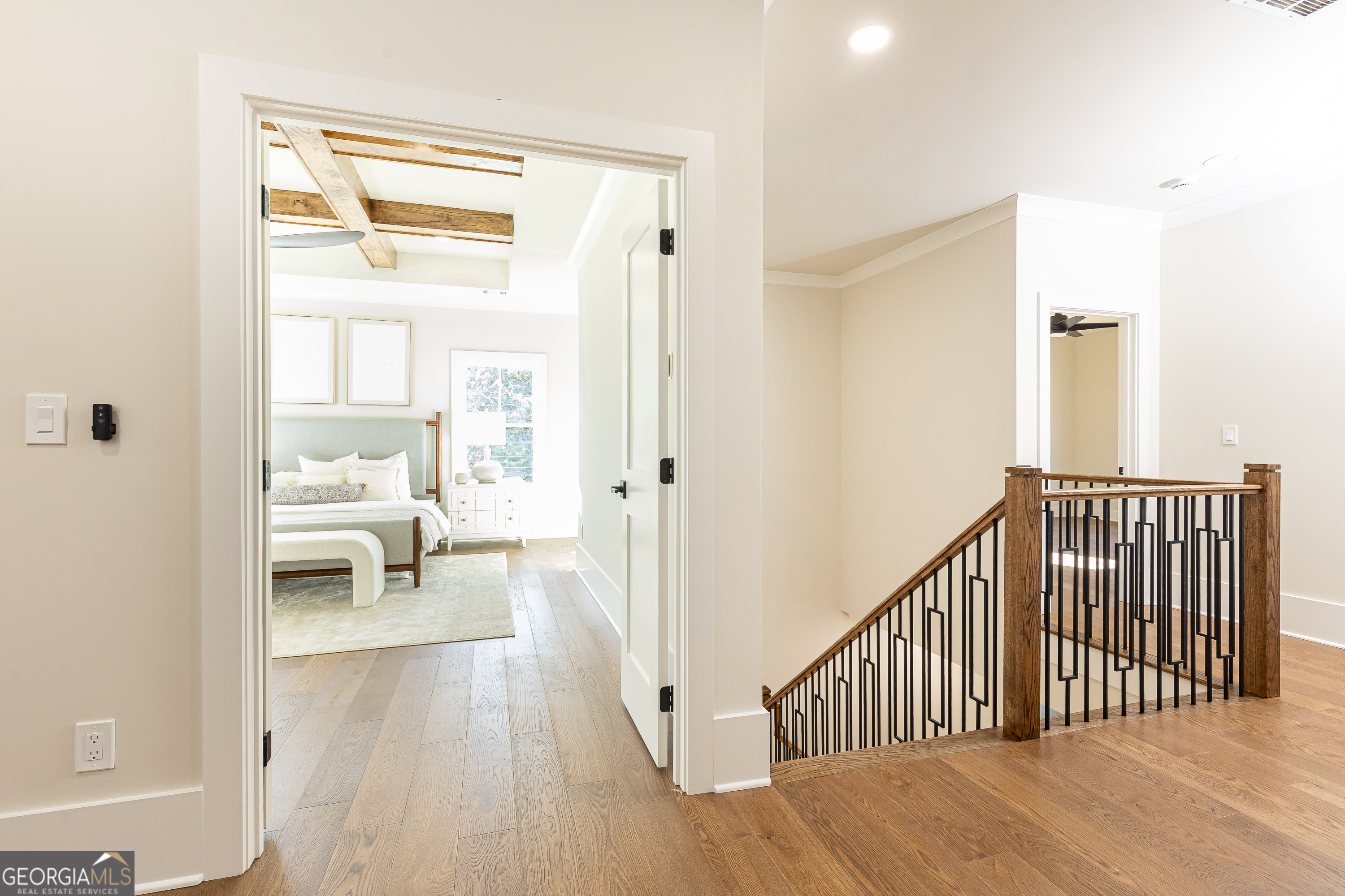 1992 Highgrove Court Atlanta, GA 30349 - Photo 12 of 22 a view of a hallway with wooden floor and a living room
