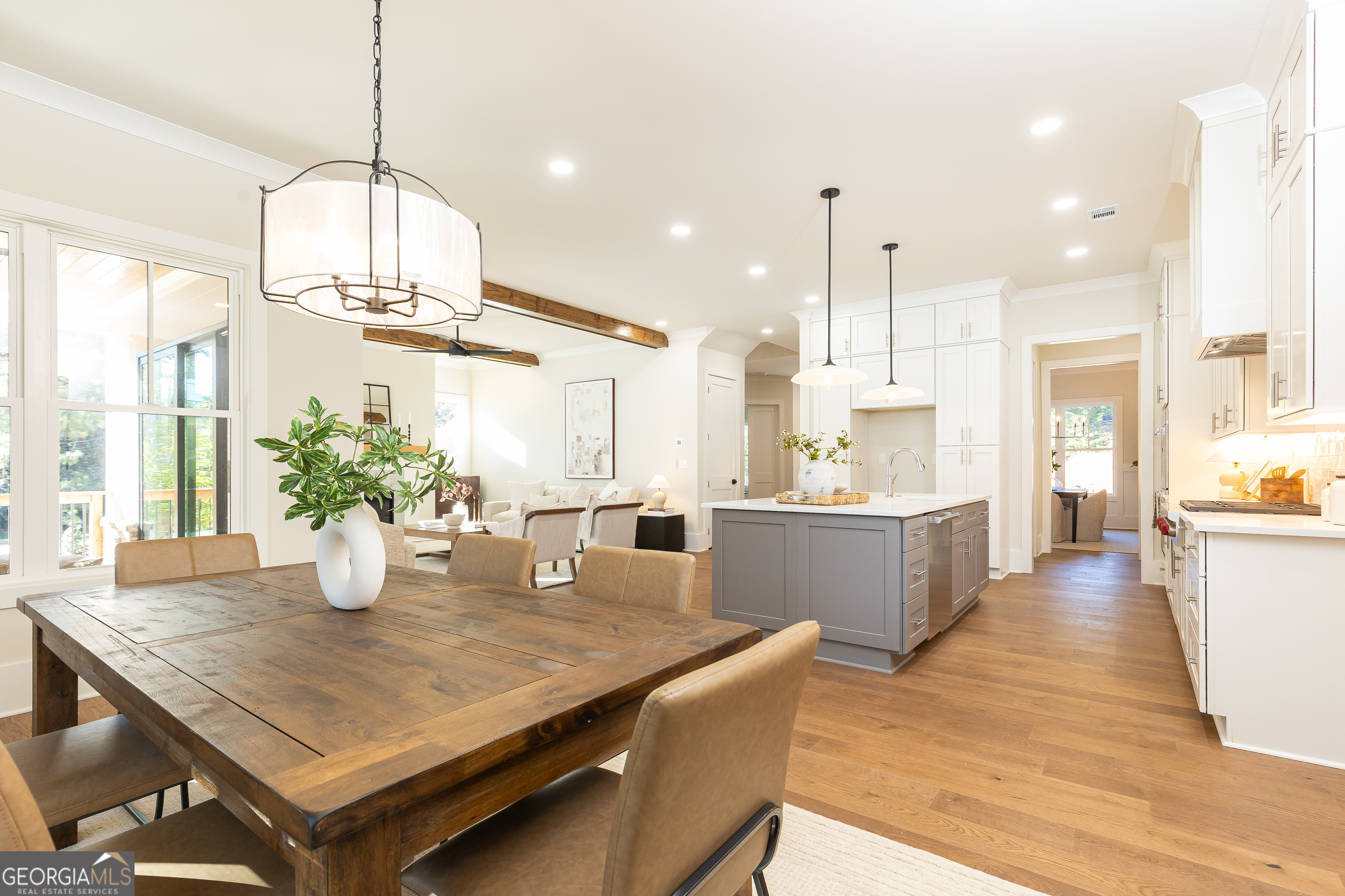1992 Highgrove Court Atlanta, GA 30349 - Photo 15 of 22 a kitchen with stainless steel appliances wooden floor dining table and chairs