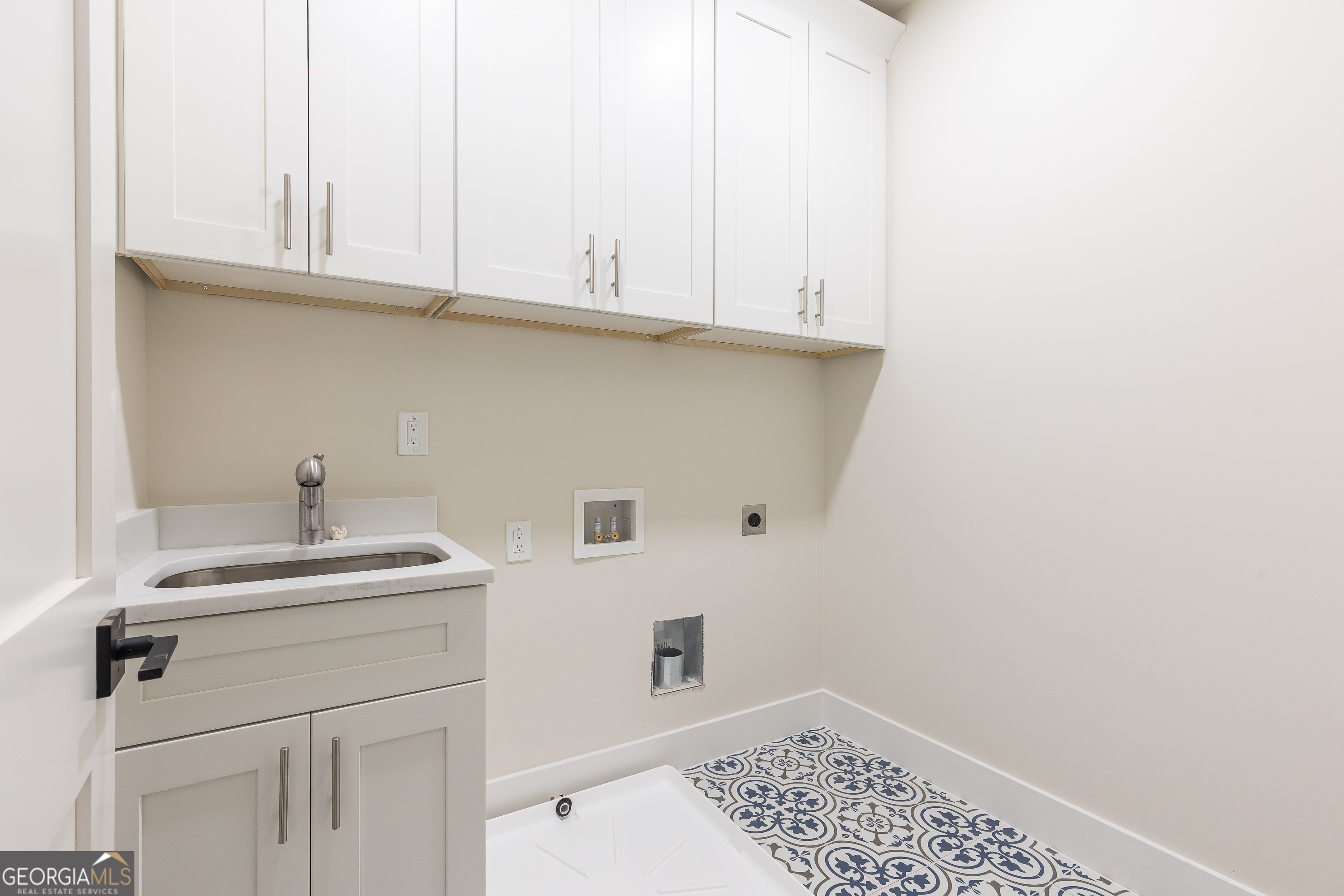 1992 Highgrove Court Atlanta, GA 30349 - Photo 18 of 22 a bathroom with a sink and cabinets