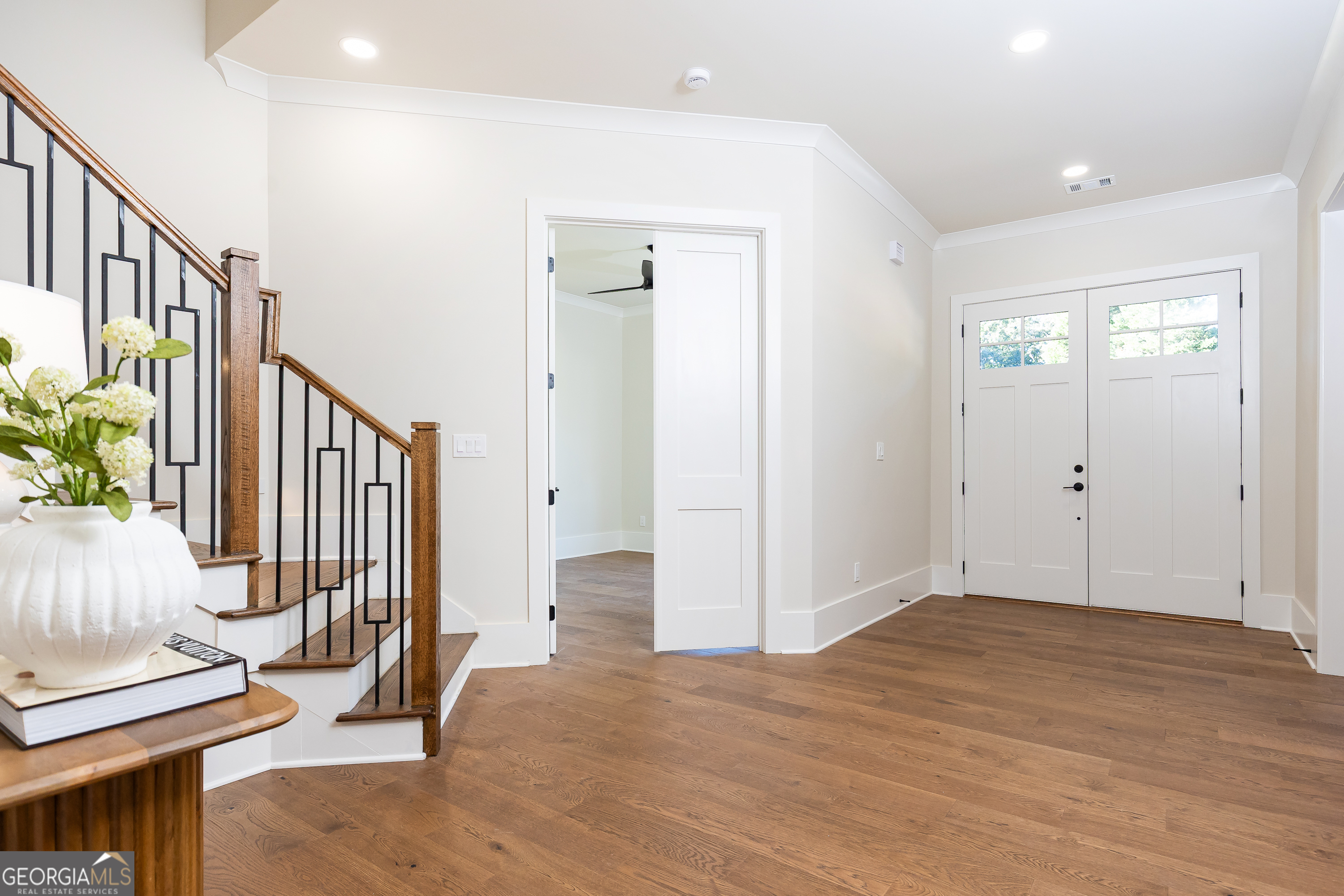1992 Highgrove Court Atlanta, GA 30349 - Photo 21 of 22 a view of an entryway with wooden floor and door