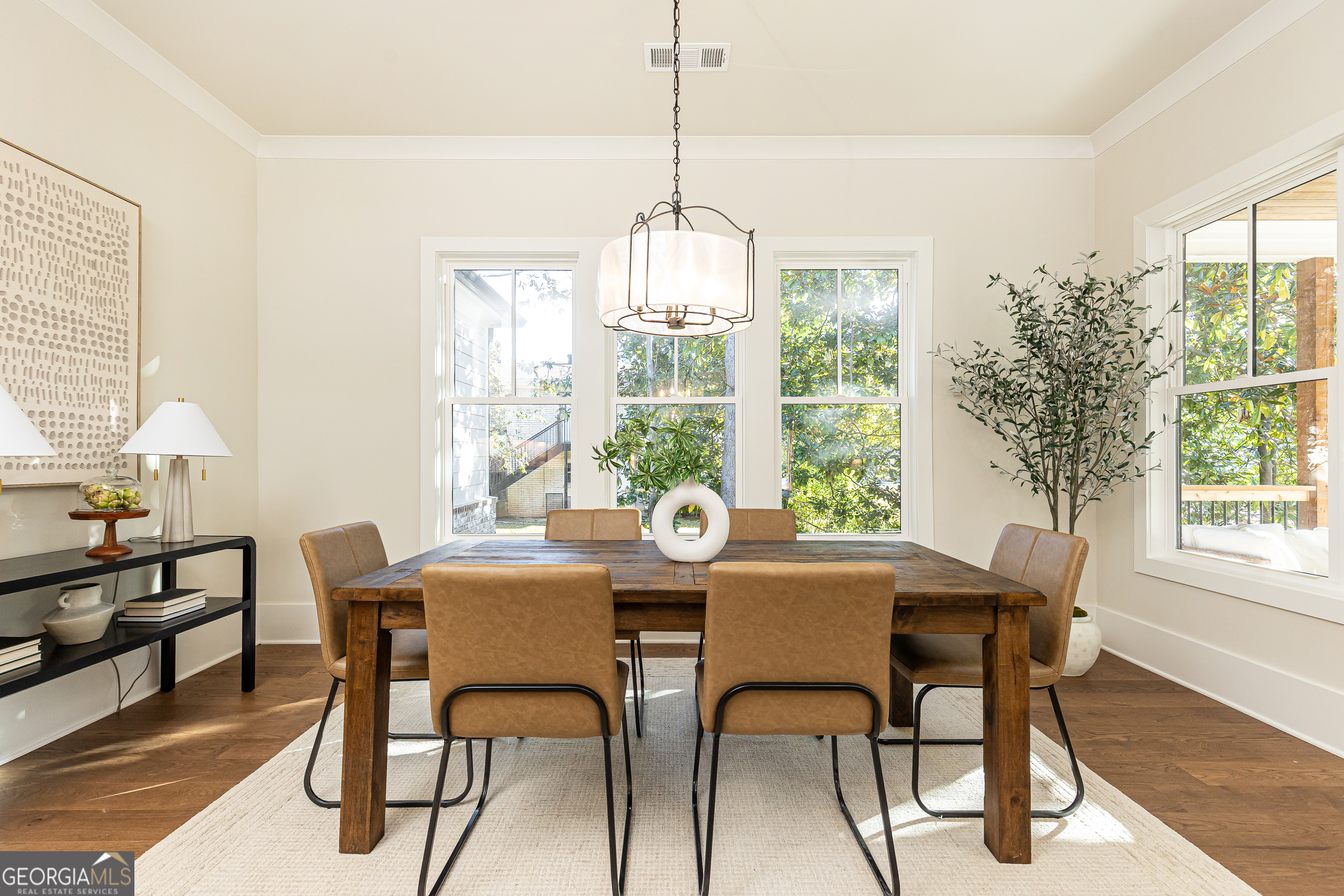 1992 Highgrove Court Atlanta, GA 30349 - Photo 22 of 22 a dining room with furniture a chandelier and wooden floor