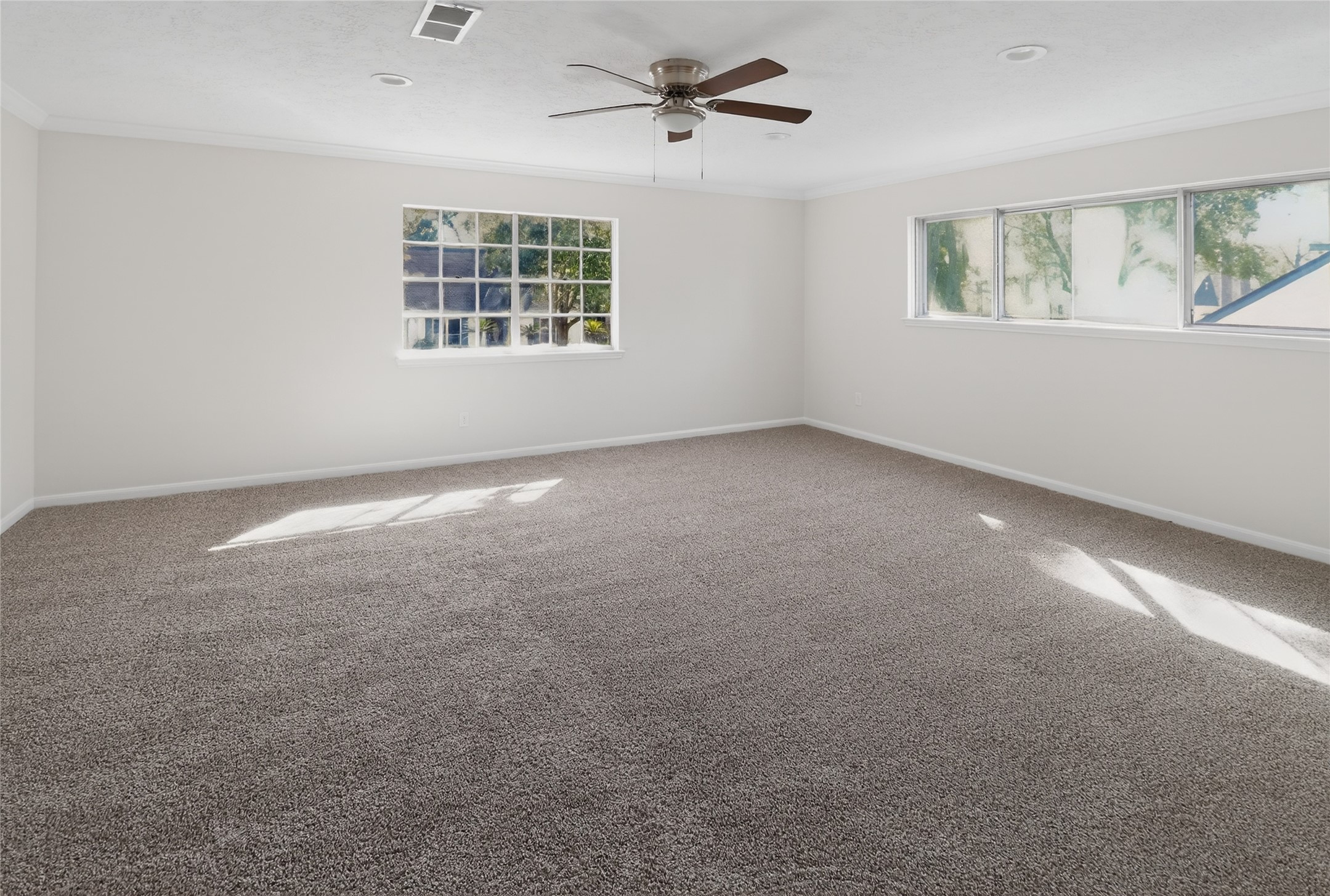 133 Cherry Tree Lane Friendswood, TX 77546 - Photo 11 of 27 an empty room with windows