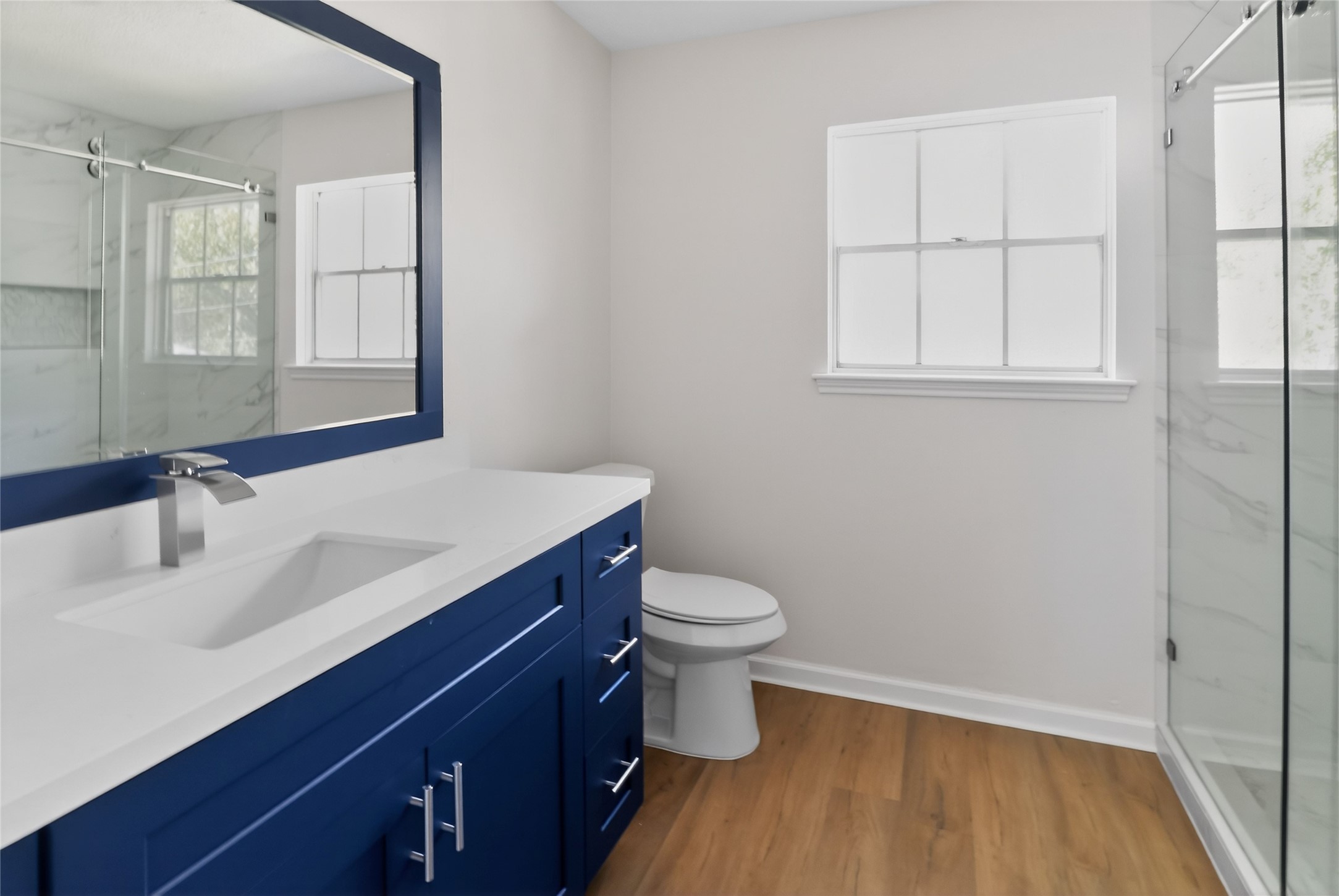 133 Cherry Tree Lane Friendswood, TX 77546 - Photo 13 of 27 a bathroom with a sink a toilet and vanity