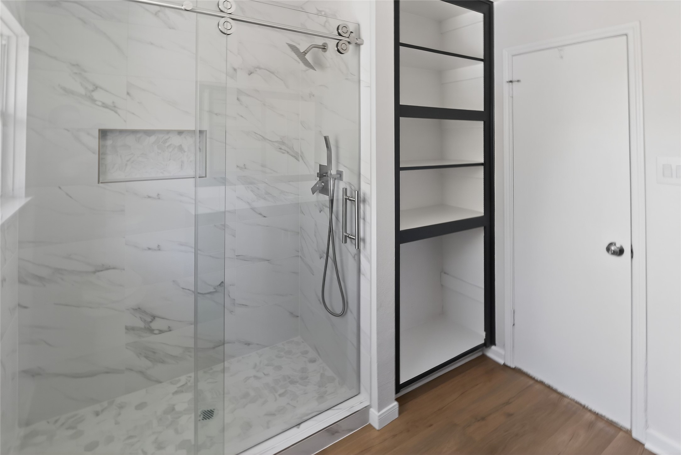 133 Cherry Tree Lane Friendswood, TX 77546 - Photo 14 of 27 a bathroom with a glass shower door