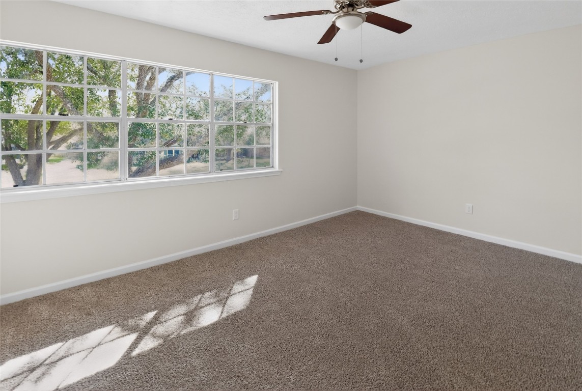133 Cherry Tree Lane Friendswood, TX 77546 - Photo 15 of 27 an empty room with a window