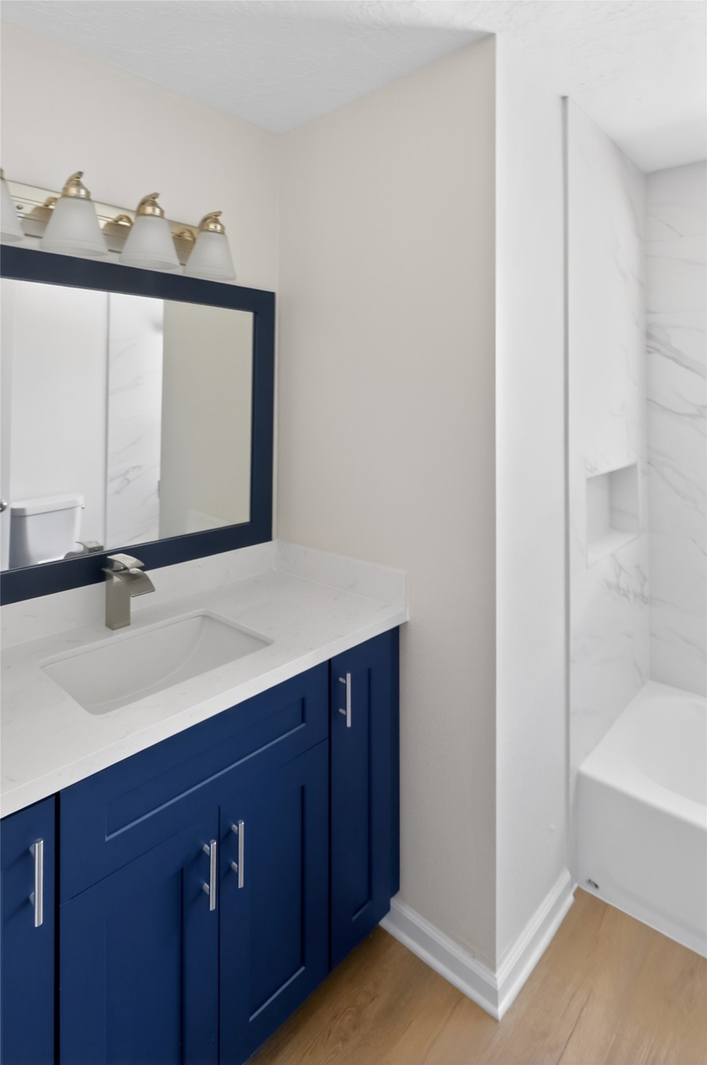 133 Cherry Tree Lane Friendswood, TX 77546 - Photo 17 of 27 a bathroom with a sink and a mirror