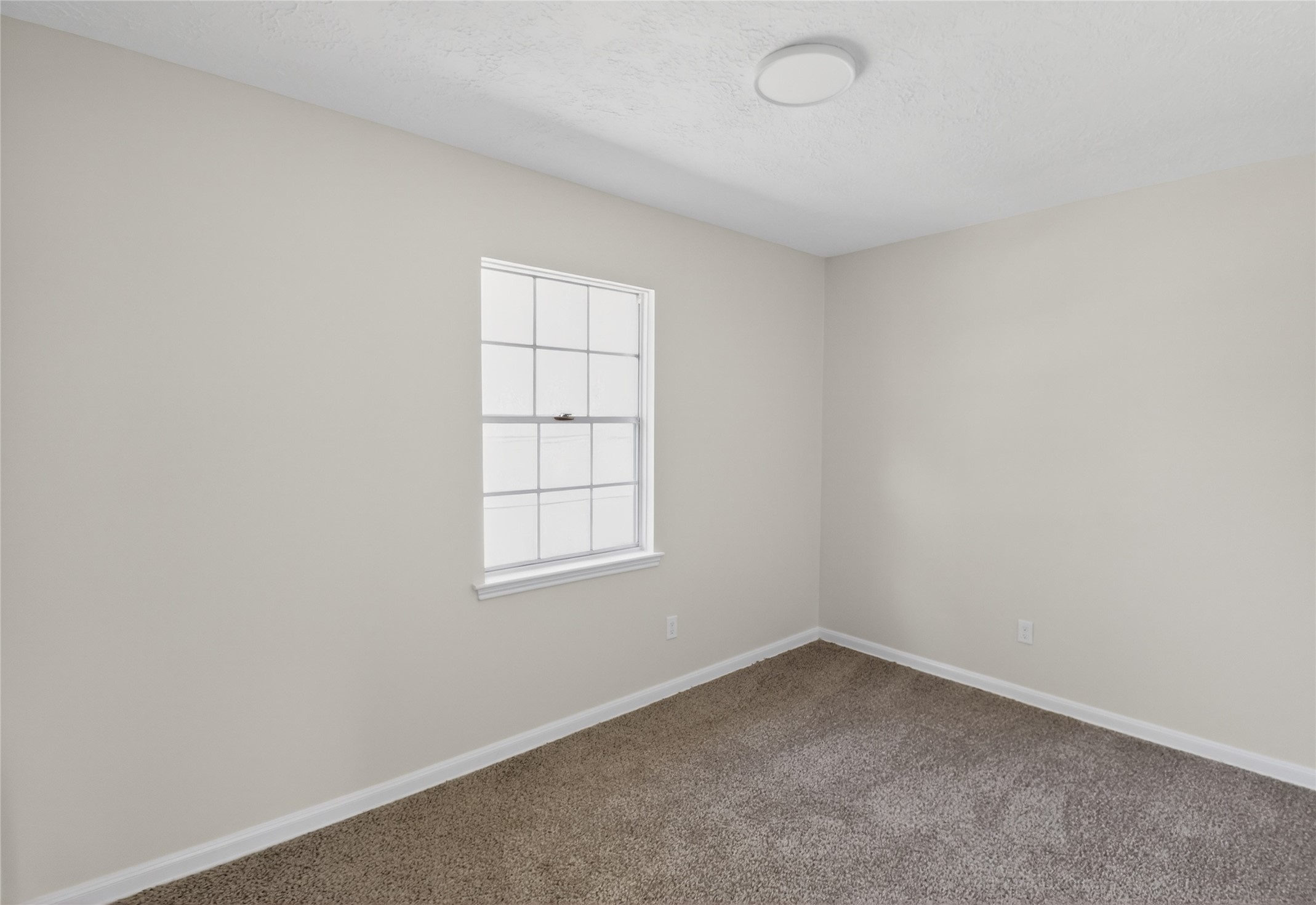 133 Cherry Tree Lane Friendswood, TX 77546 - Photo 19 of 27 an empty room with a window