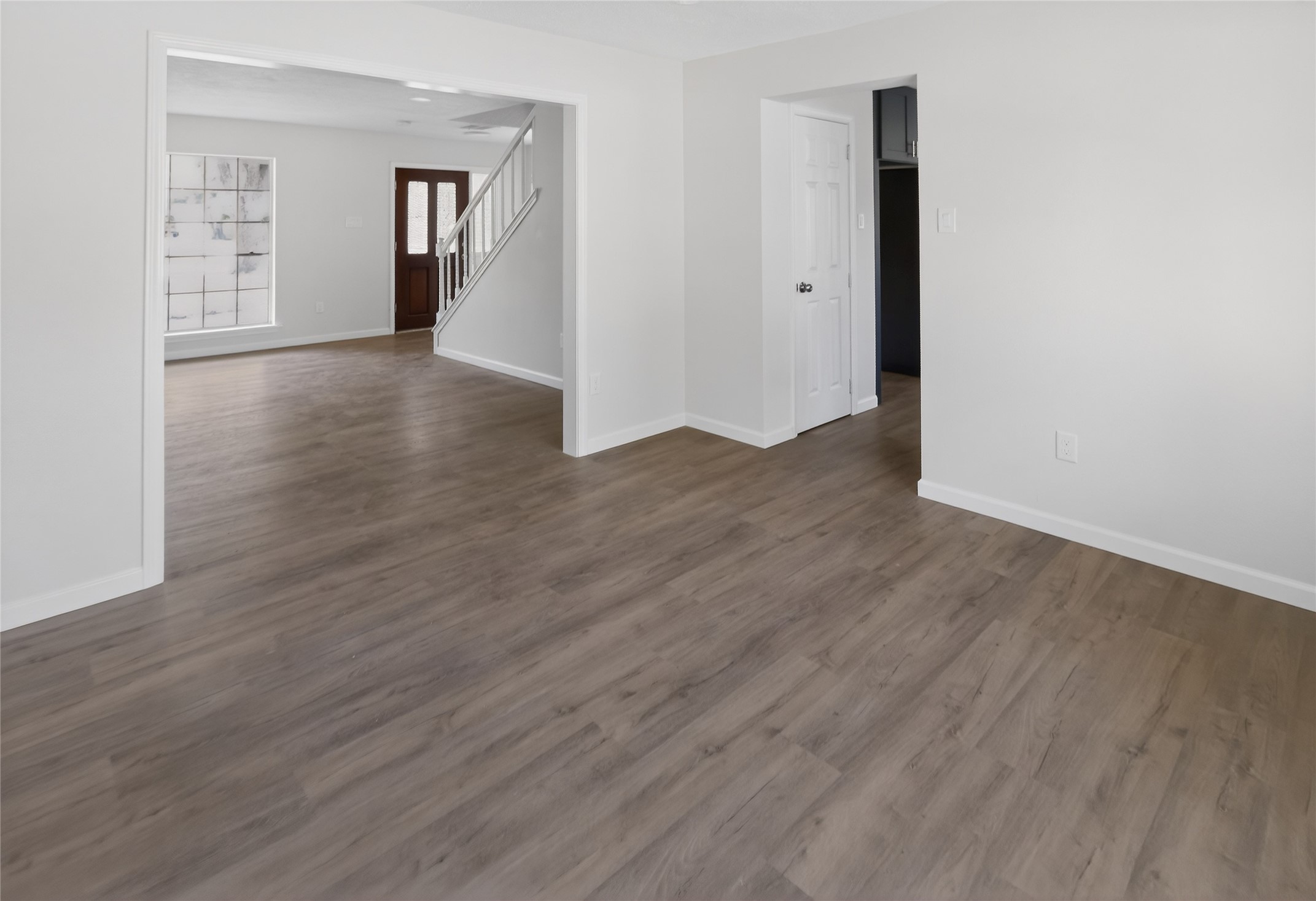 133 Cherry Tree Lane Friendswood, TX 77546 - Photo 3 of 27 an empty room with wooden floor and closet