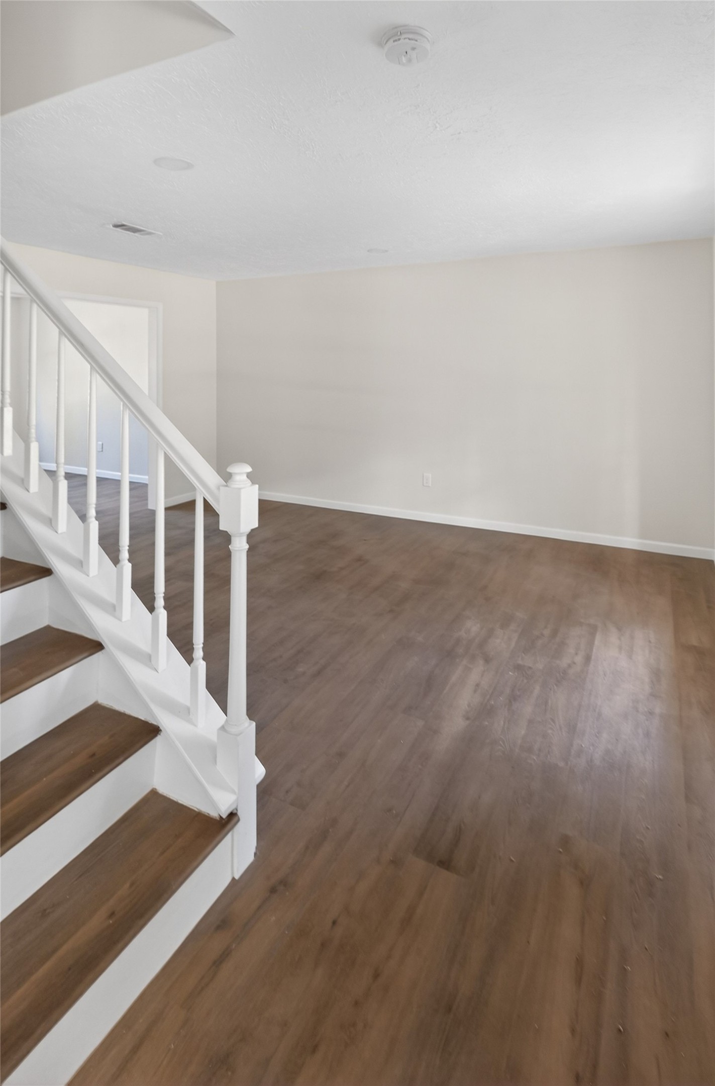 133 Cherry Tree Lane Friendswood, TX 77546 - Photo 4 of 27 a view of entryway with wooden floor
