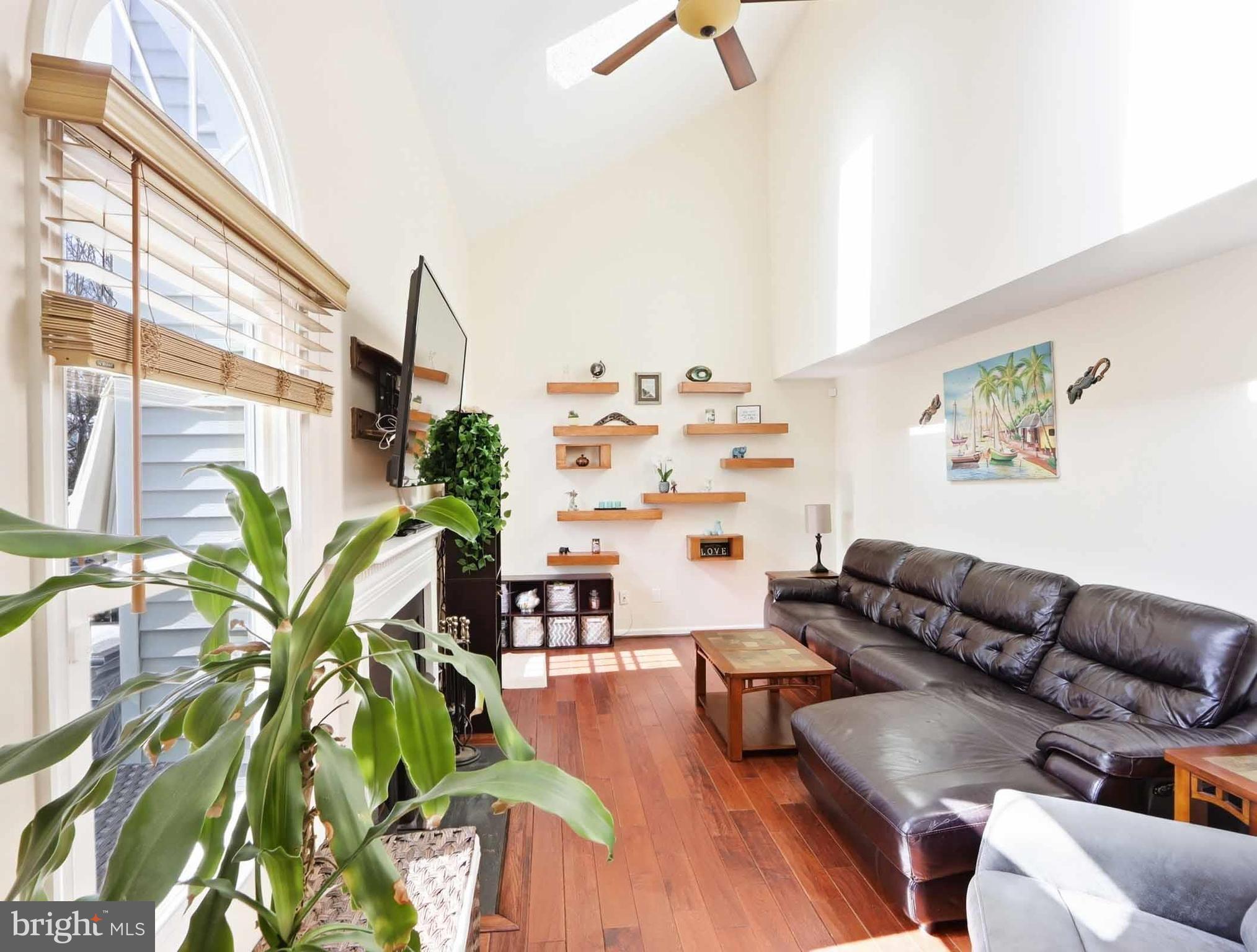 12208 Stoney Bottom Road Germantown, MD 20874 - Photo 14 of 52 a living room with furniture plant and a window