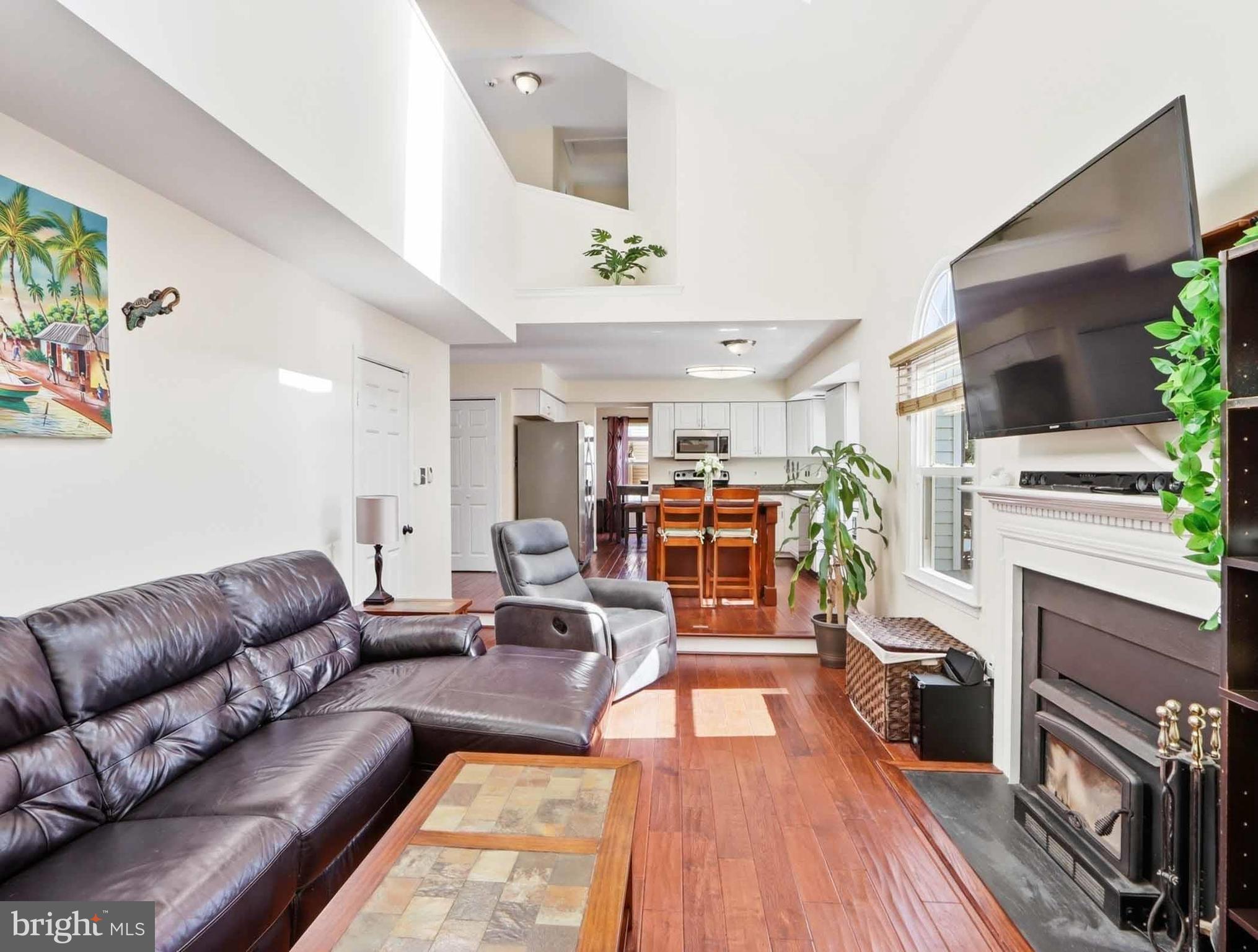 12208 Stoney Bottom Road Germantown, MD 20874 - Photo 15 of 52 a living room with furniture fireplace and flat screen tv