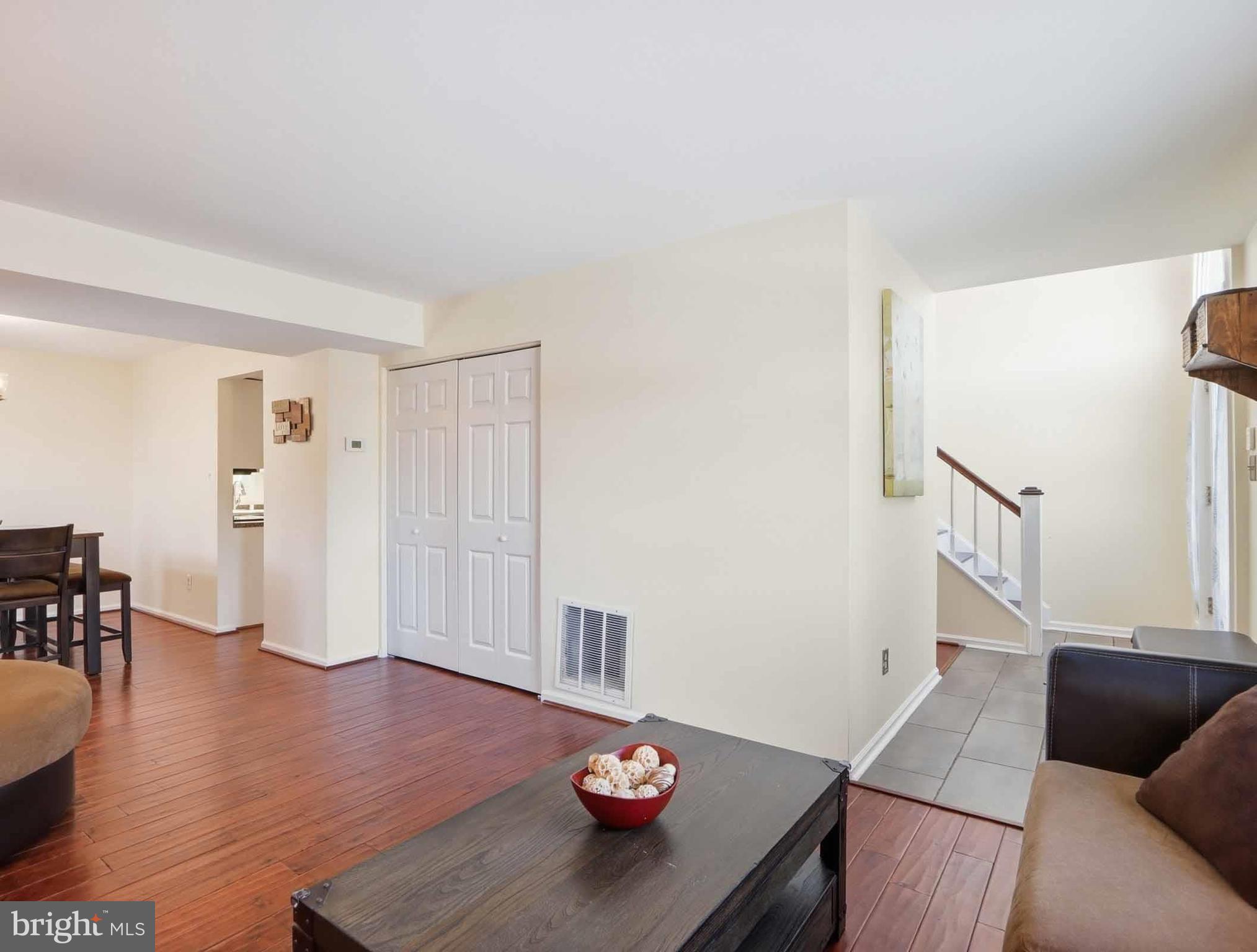 12208 Stoney Bottom Road Germantown, MD 20874 - Photo 18 of 52 a living room with furniture and wooden floor