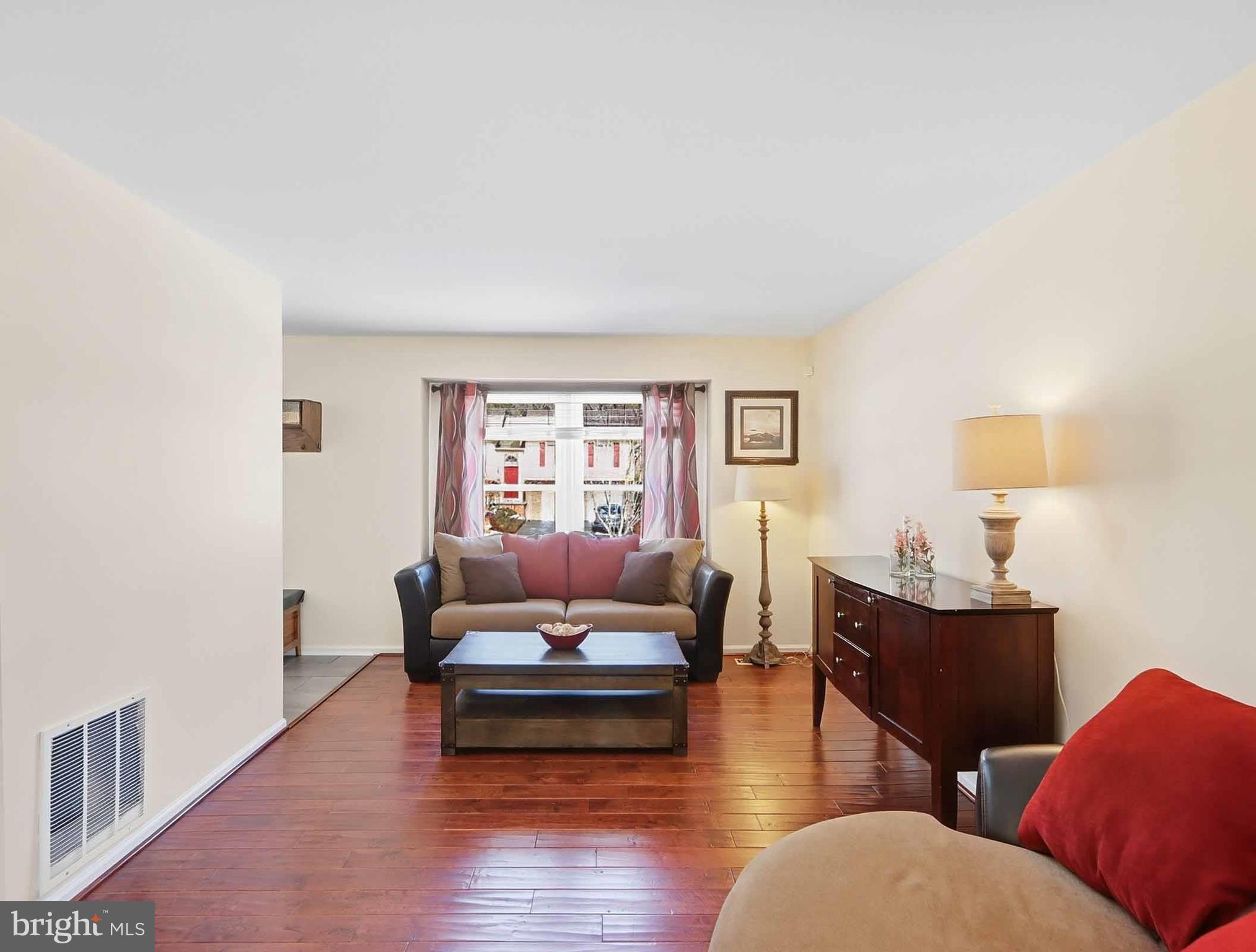 12208 Stoney Bottom Road Germantown, MD 20874 - Photo 19 of 52 a living room with furniture and wooden floor