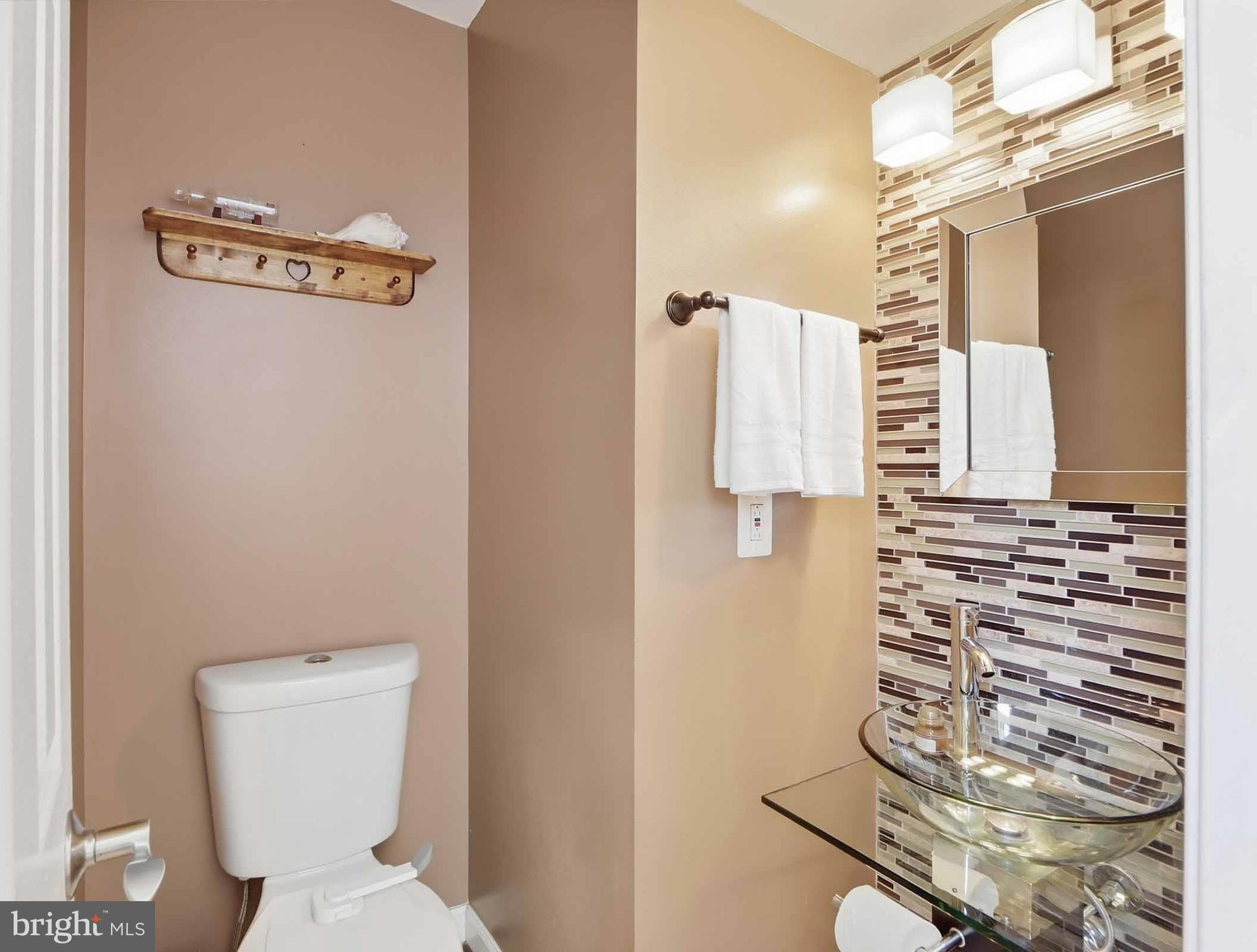 12208 Stoney Bottom Road Germantown, MD 20874 - Photo 22 of 52 a bathroom with a toilet and a mirror